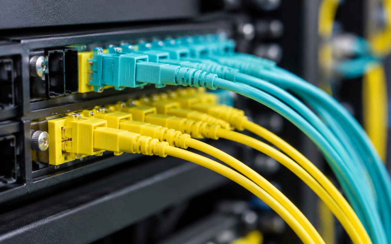 Fibre patch panel with yellow and aqua connectors and patch leads